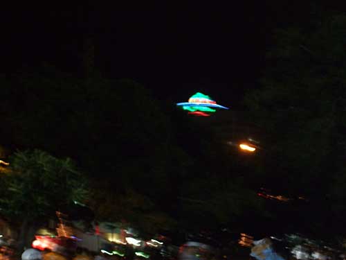 UFO atop a restaurant in the dark