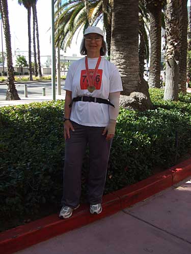 me, in front of the hotel, with finisher's medal