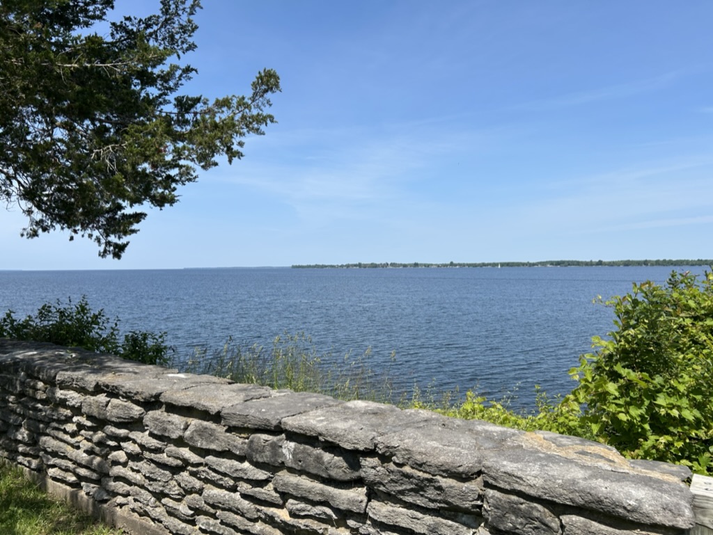 View of Lake Ontario from behind a stone fence