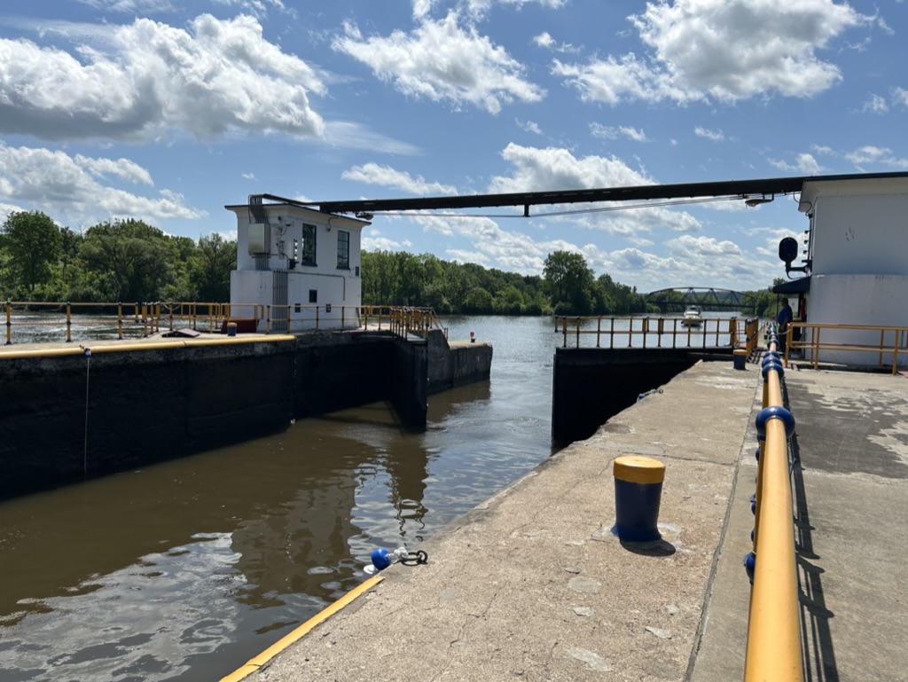 The lock opens for a boat approaching on the Erie Canal